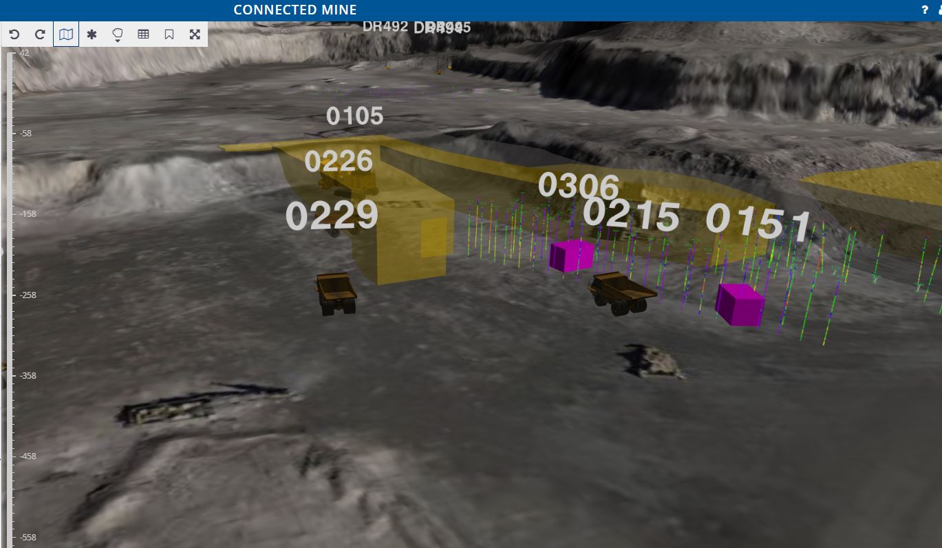 Connected Spatial Intelligence 3D view of haul trucks and loaders working within planned dig polygons, with drill hole traces in the pit
